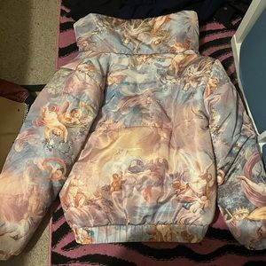 A puffer jacket with Angeles on it
